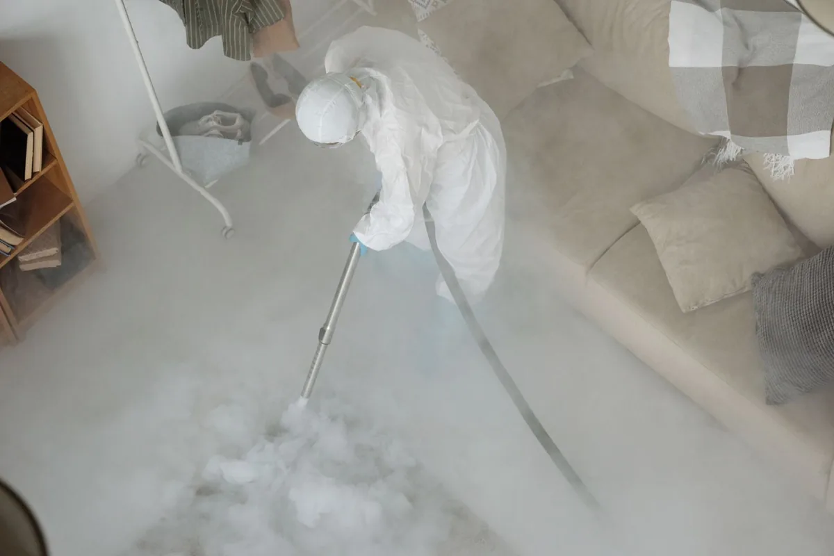 Biohazard cleanup technician in protective equipment, Marcellus, NY